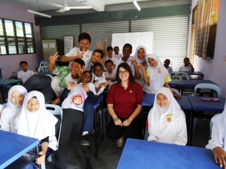 Ms Jemma Smalley-Roberts (in red t-shirt) surrounded by some of her students at Sekolah Kebangsaan Methodist Tanjong Malim, Perak.